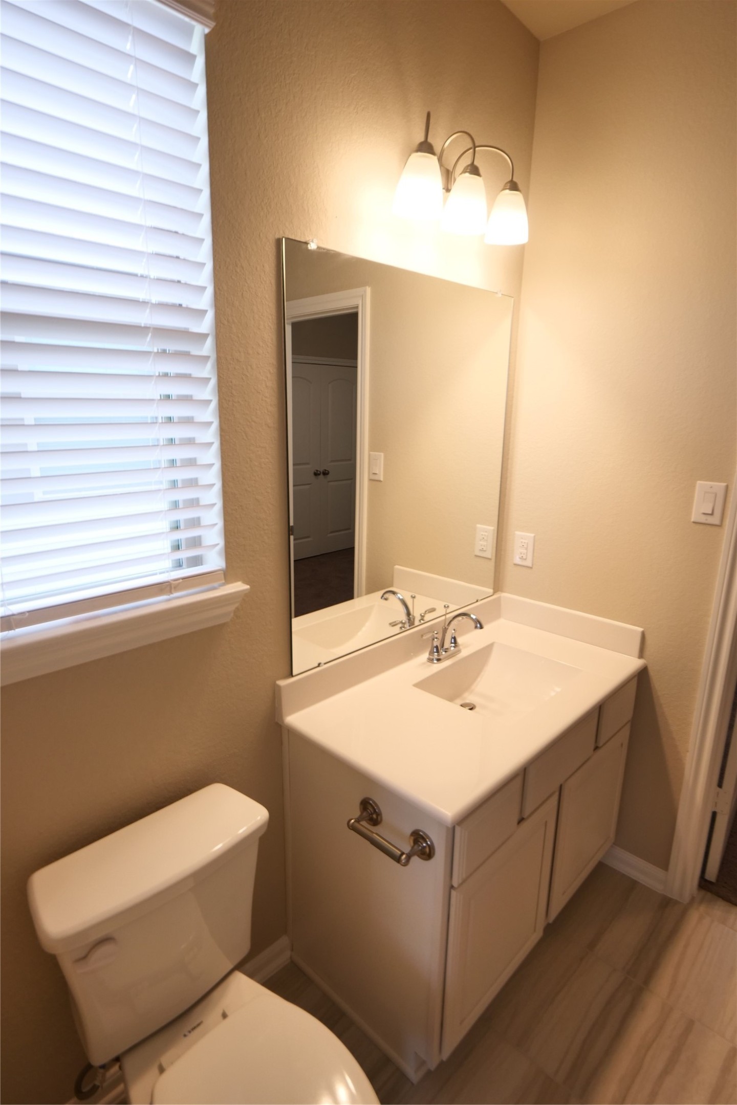 5110 Prairie Terrace Fulshear, TX 77441 - Photo 26 of 31 a bathroom with a sink toilet and mirror