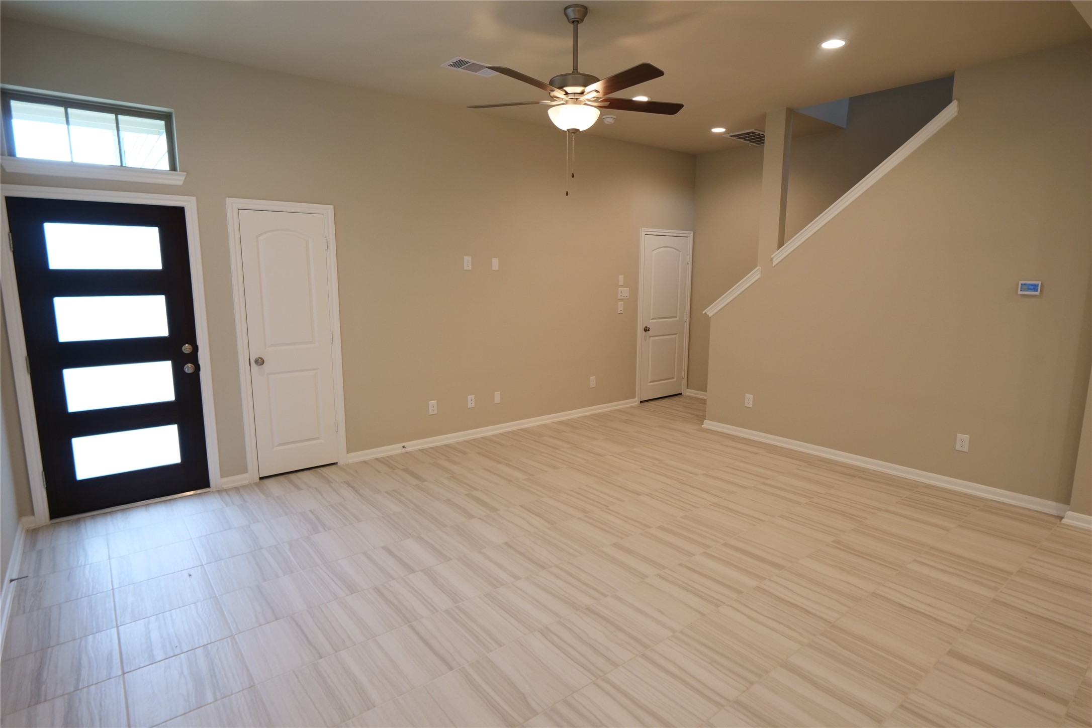 5110 Prairie Terrace Fulshear, TX 77441 - Photo 6 of 31 wooden floor in an empty room with a window