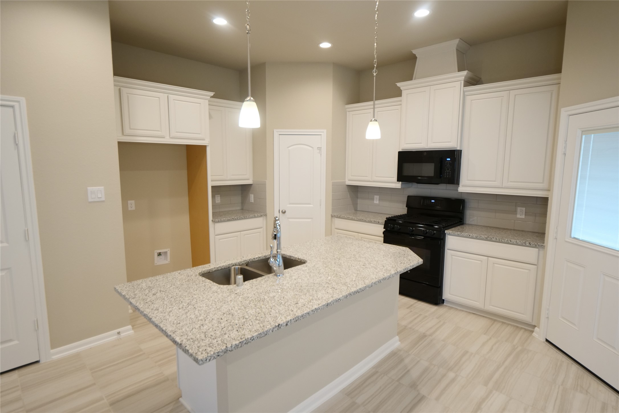 5110 Prairie Terrace Fulshear, TX 77441 - Photo 8 of 31 a kitchen with stainless steel appliances granite countertop a sink dishwasher a stove and a refrigerator with wooden floor