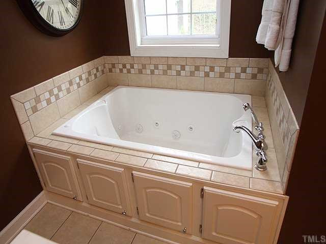 629 Macon Place Raleigh, NC 27609 - Photo 8 of 12 Master completely redone, huge square jacuzzi tub awaits you, separate shower ,dual vanities, new cabinets, tile floor....what more could you ask for.