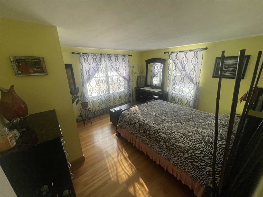 8 Scraggy Neck Rd Extension Bourne, MA 02534 - Photo 14 of 17 a bedroom with a bed and a window