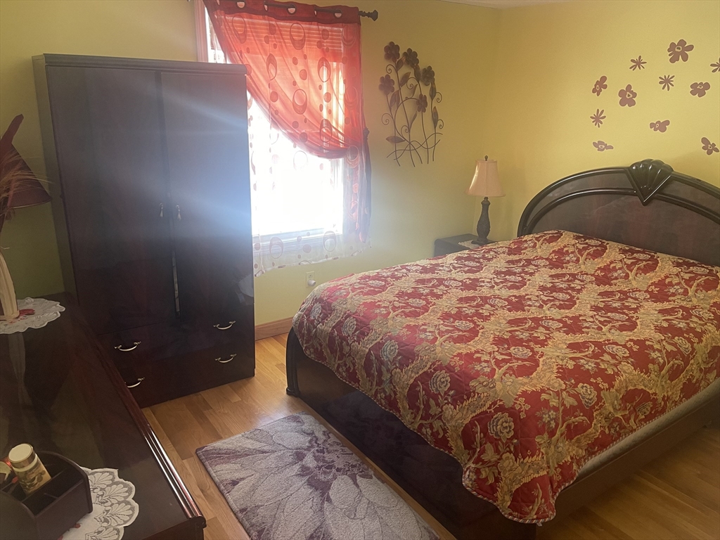 8 Scraggy Neck Rd Extension Bourne, MA 02534 - Photo 15 of 17 a bedroom with a bed and a window