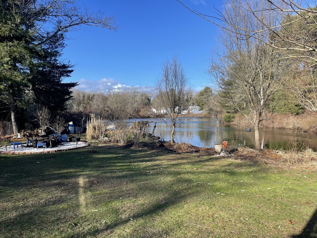 8 Scraggy Neck Rd Extension Bourne, MA 02534 - Photo 7 of 17 a view of a lake with houses