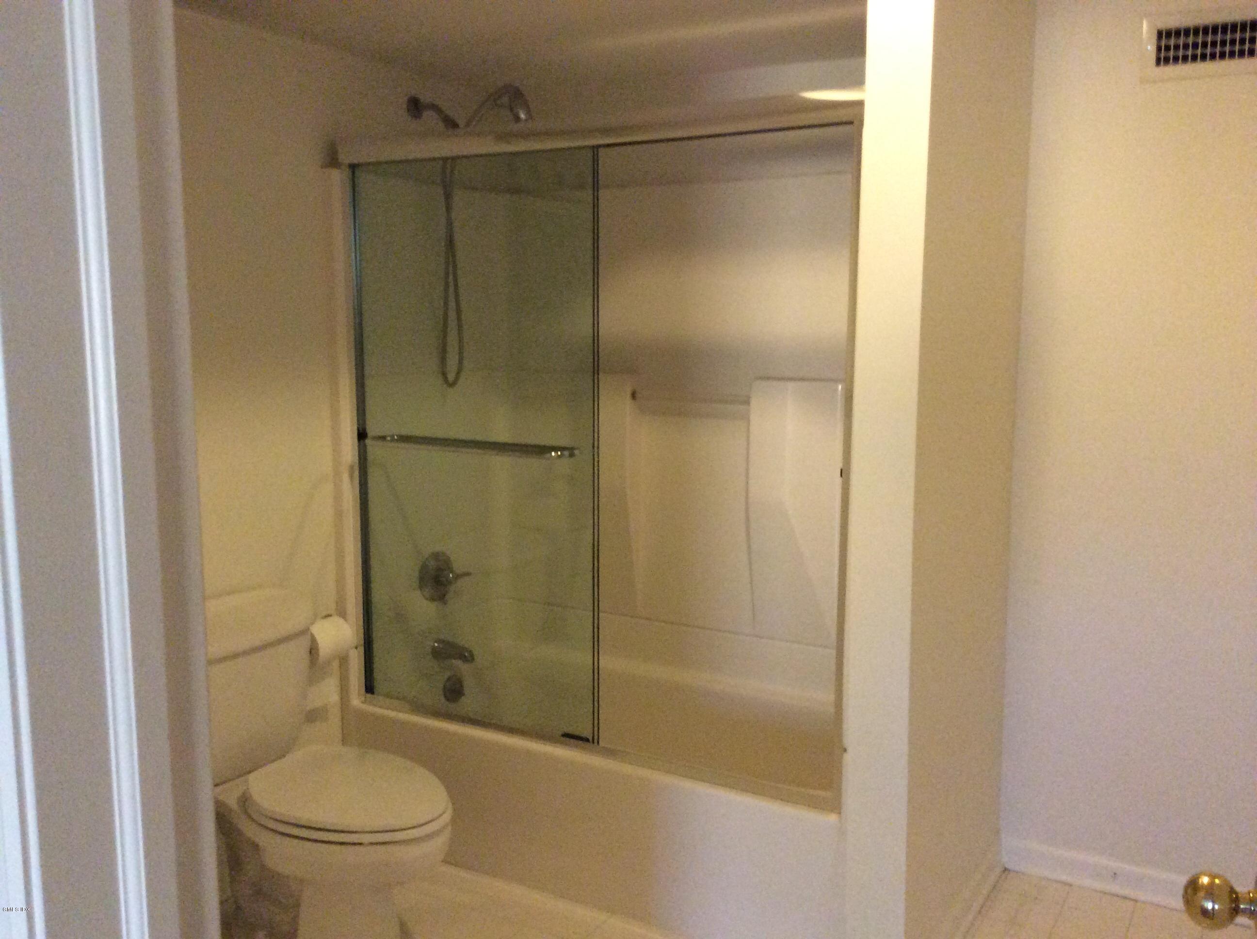 3 Stanwich Road Greenwich, CT 06830 - Photo 12 of 17 a bathroom with a shower a toilet and a sink