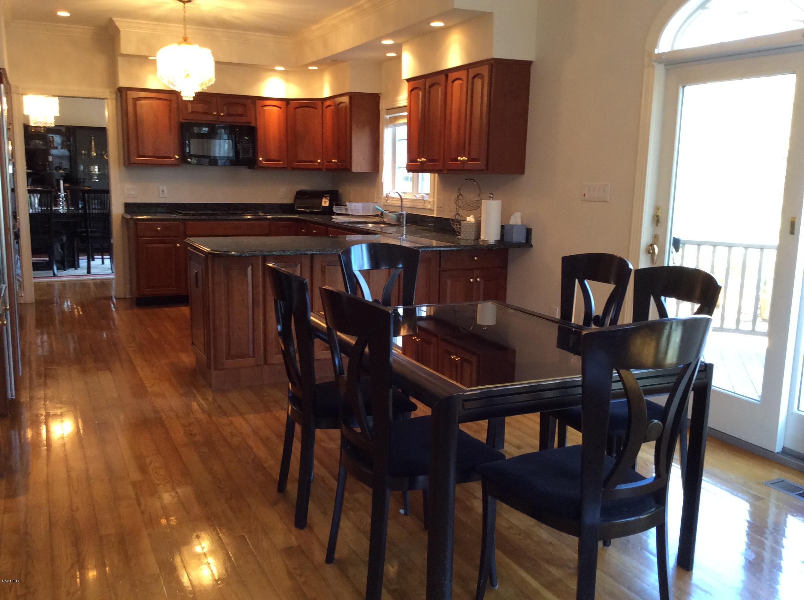 3 Stanwich Road Greenwich, CT 06830 - Photo 3 of 17 a view of a dining room with furniture and wooden floor