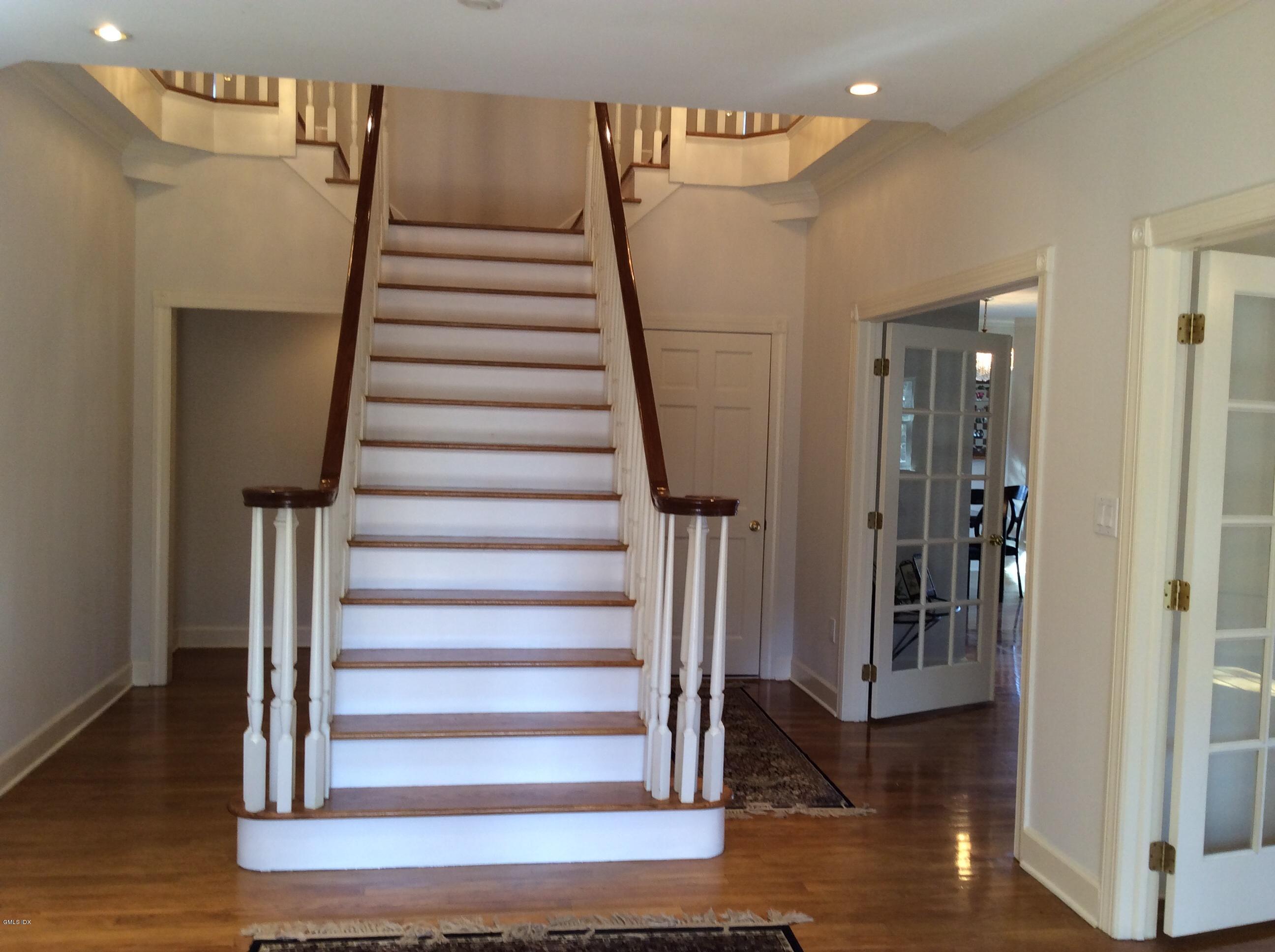 3 Stanwich Road Greenwich, CT 06830 - Photo 5 of 17 a view of entryway and hall with wooden floor