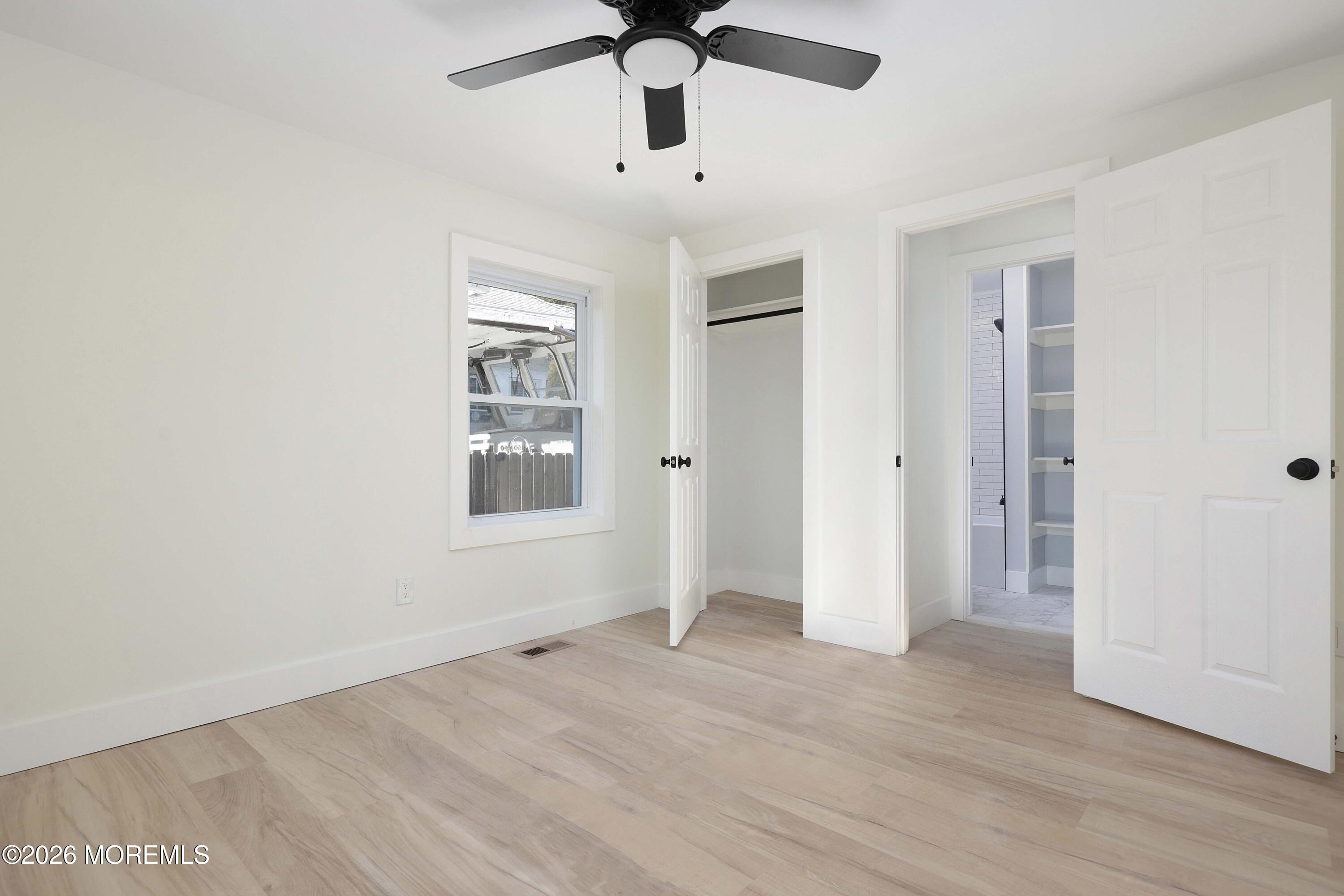 1216 8th Avenue Neptune, NJ 07753 - Photo 23 of 29 wooden floor in an empty room with a window
