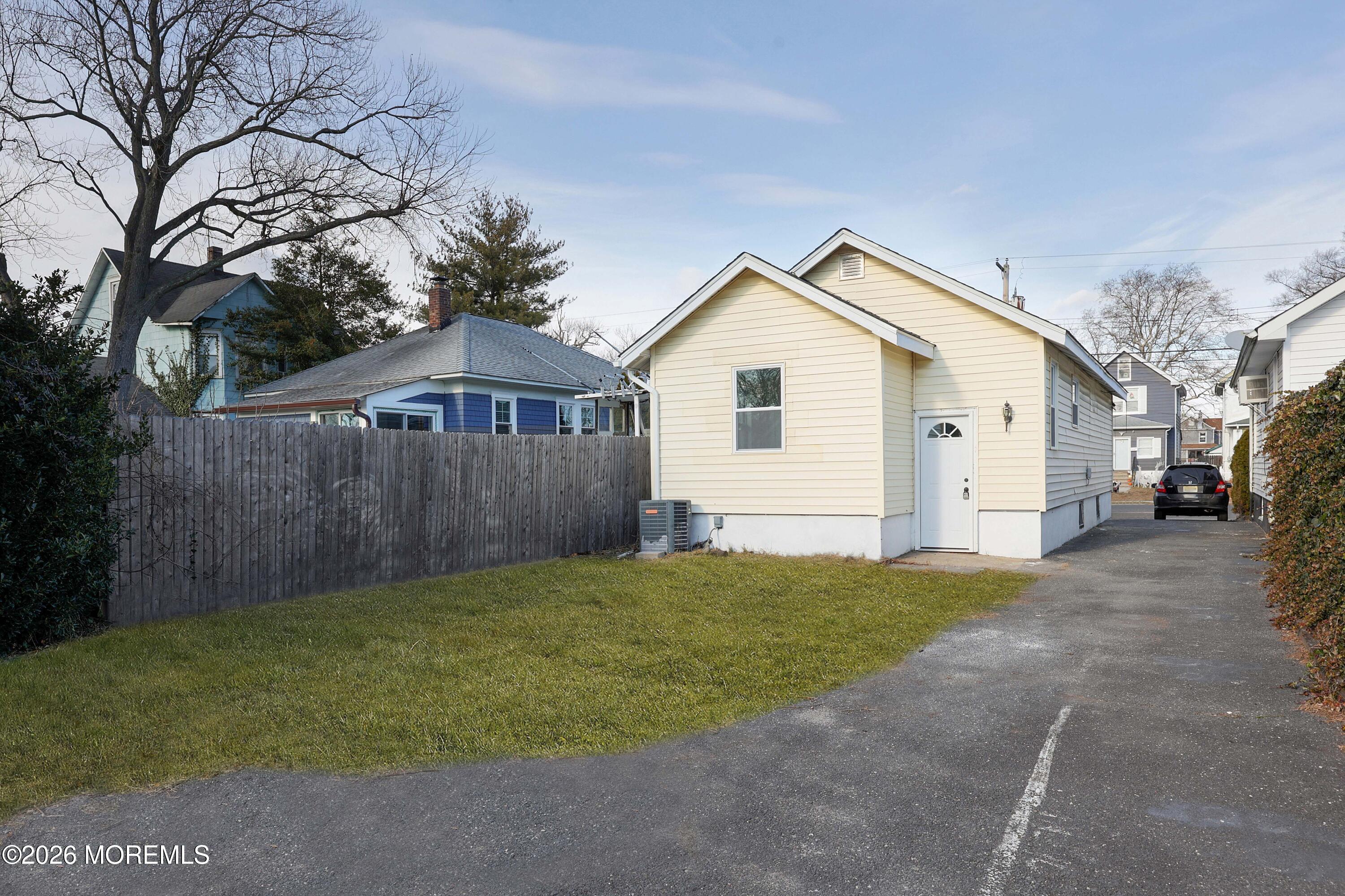 1216 8th Avenue Neptune, NJ 07753 - Photo 28 of 29 a view of a back yard of the house