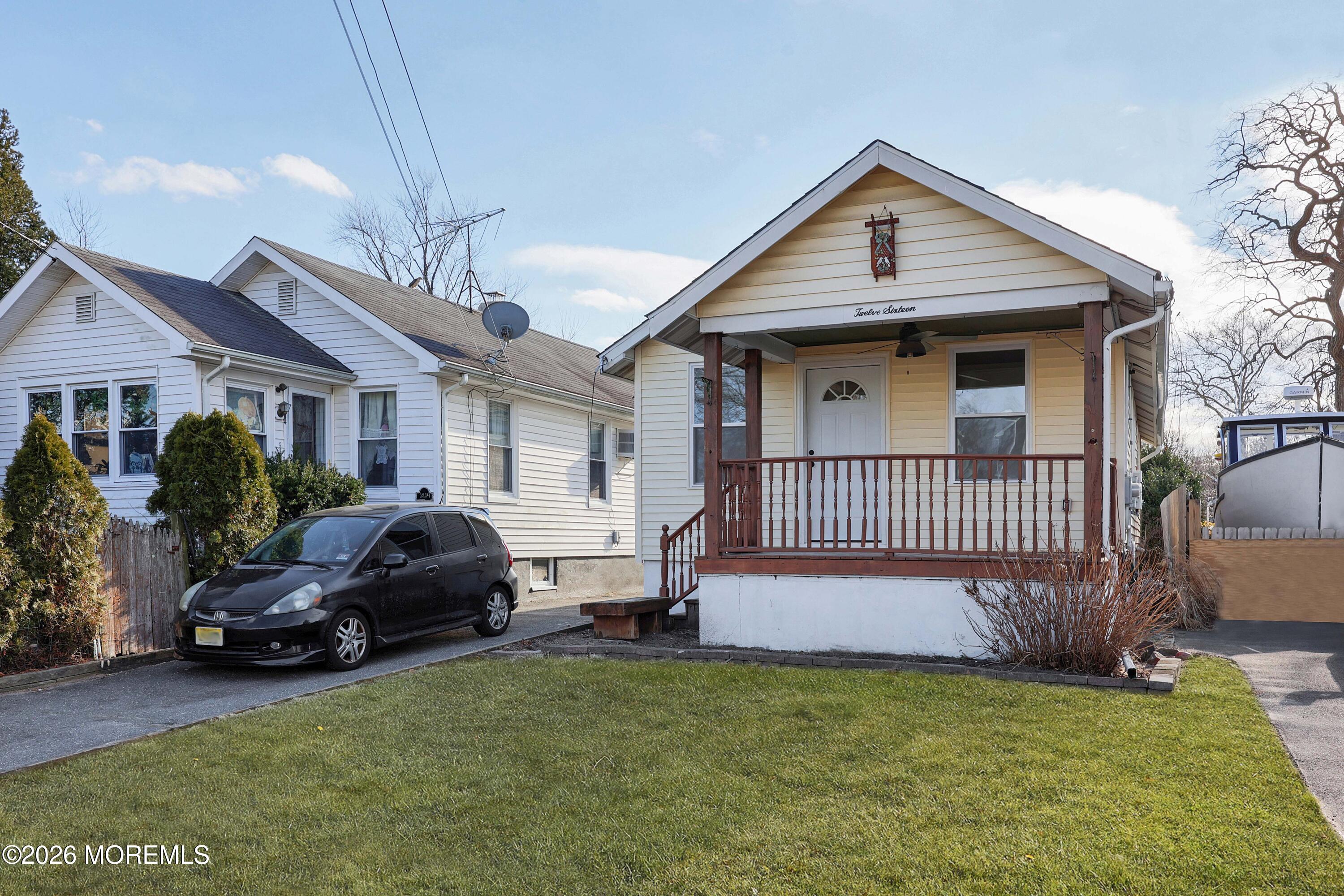 1216 8th Avenue Neptune, NJ 07753 - Photo 3 of 29 a view of a house with a garden and deck