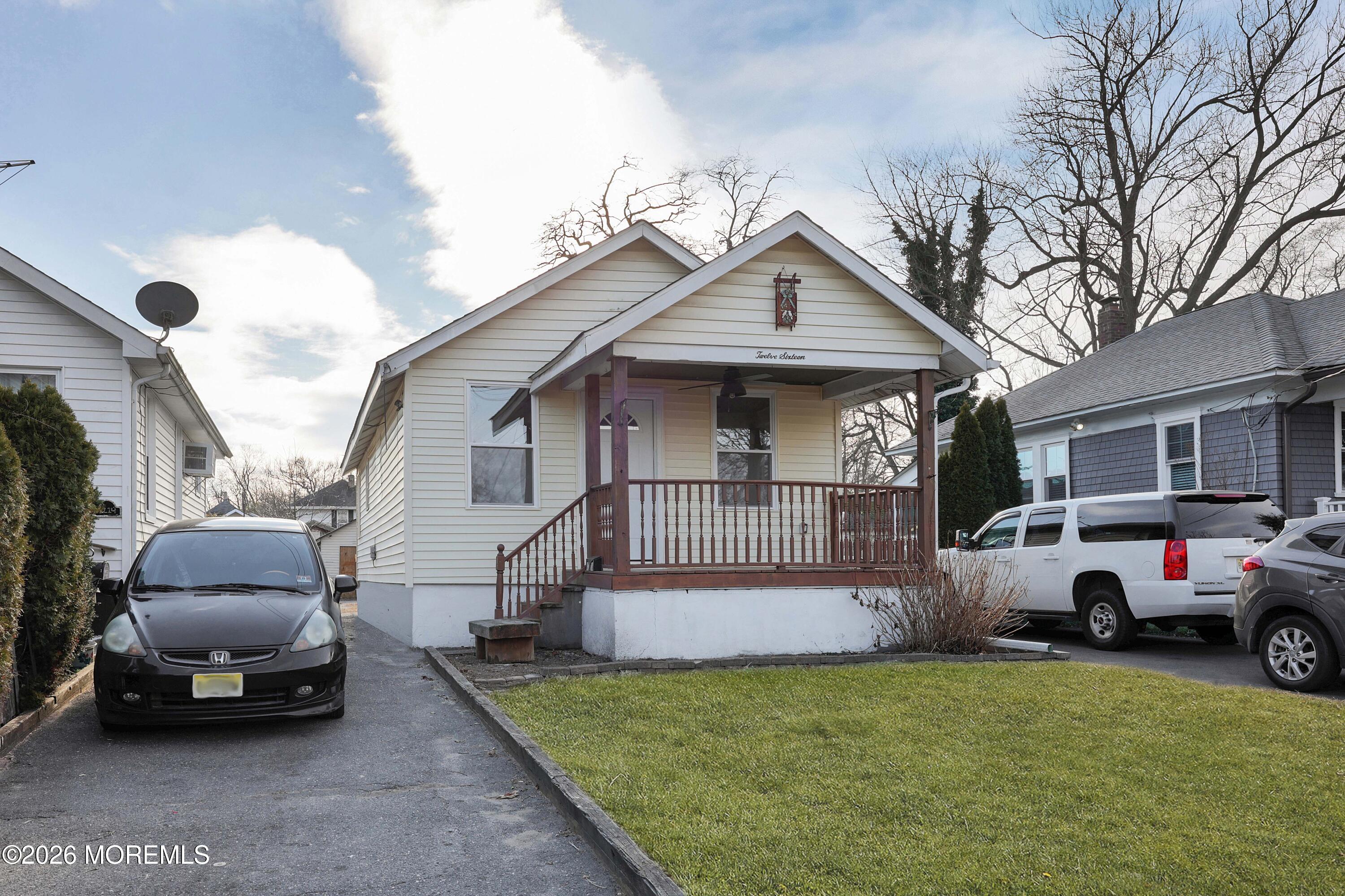 1216 8th Avenue Neptune, NJ 07753 - Photo 4 of 29 a view of a car in front of house