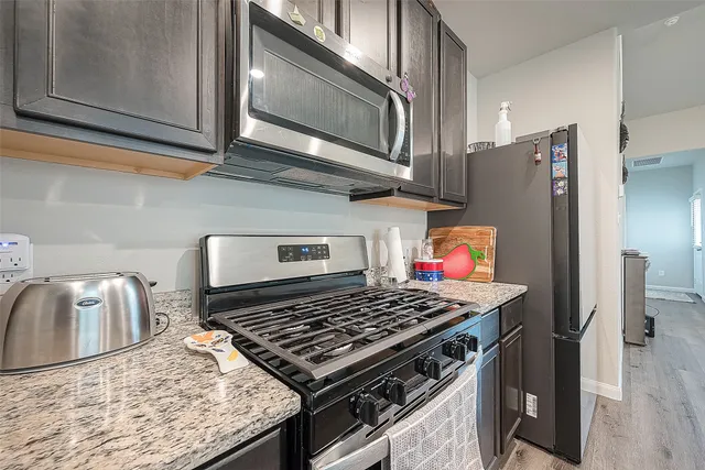 a kitchen with a sink and a large window