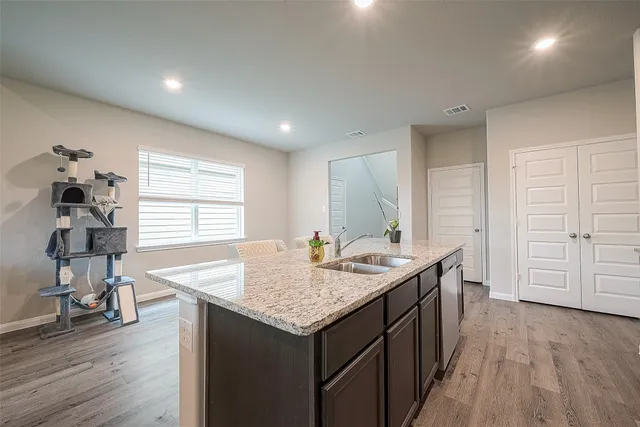 a kitchen with stainless steel appliances granite countertop a stove and a microwave
