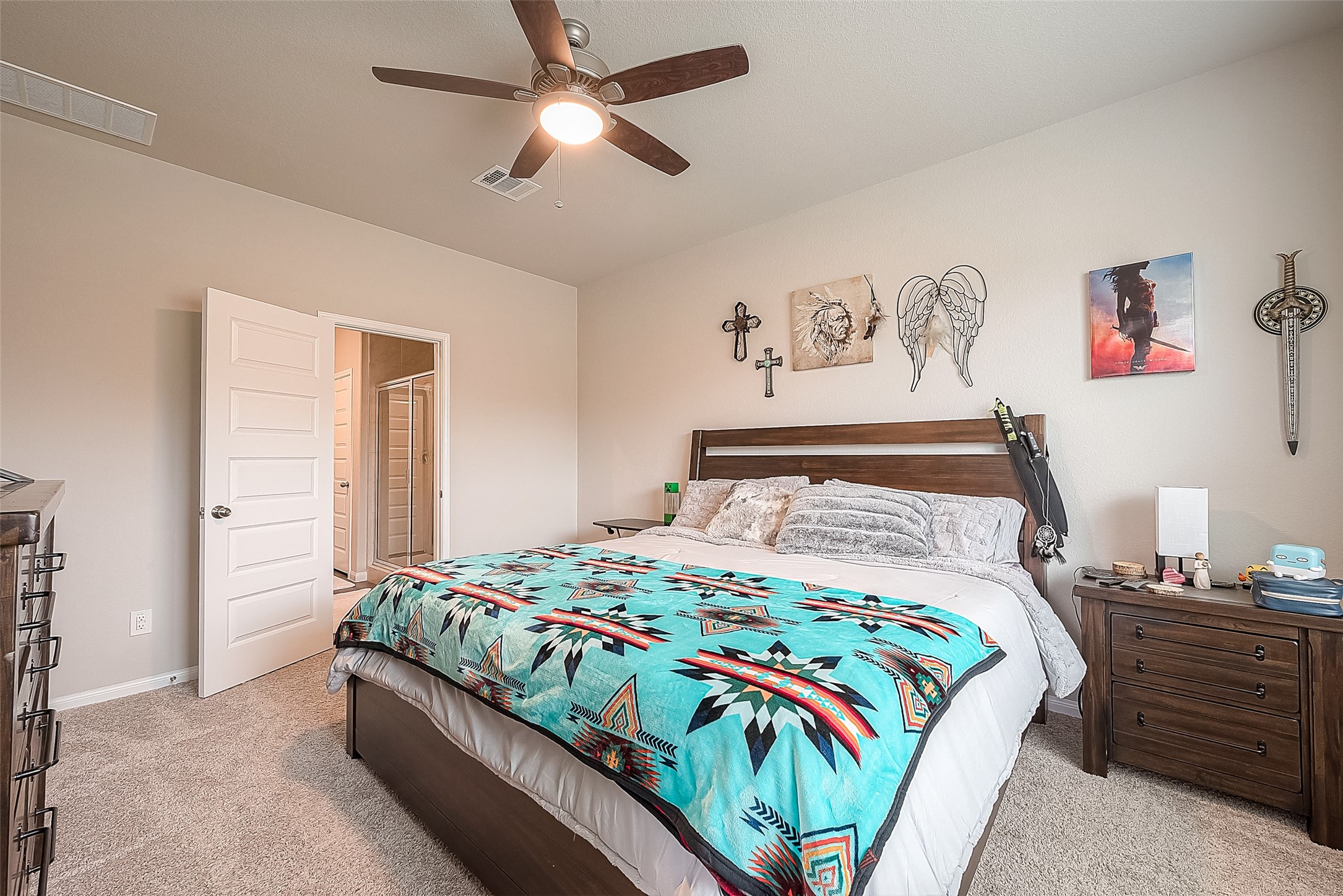 1317 Mount Bassie Trail Conroe, TX 77301 - Photo 24 of 50 a bedroom with a bed and cabinets