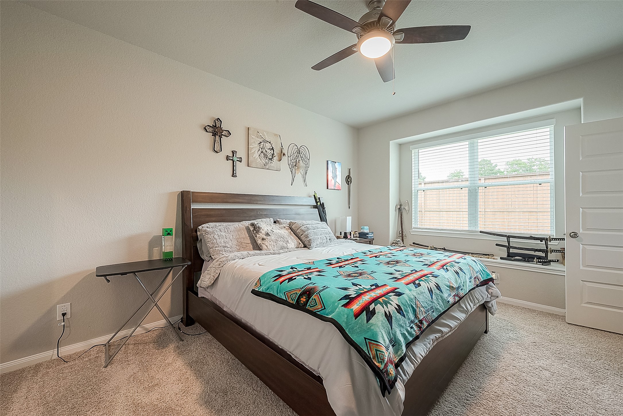 1317 Mount Bassie Trail Conroe, TX 77301 - Photo 26 of 50 a bedroom with a bed and window