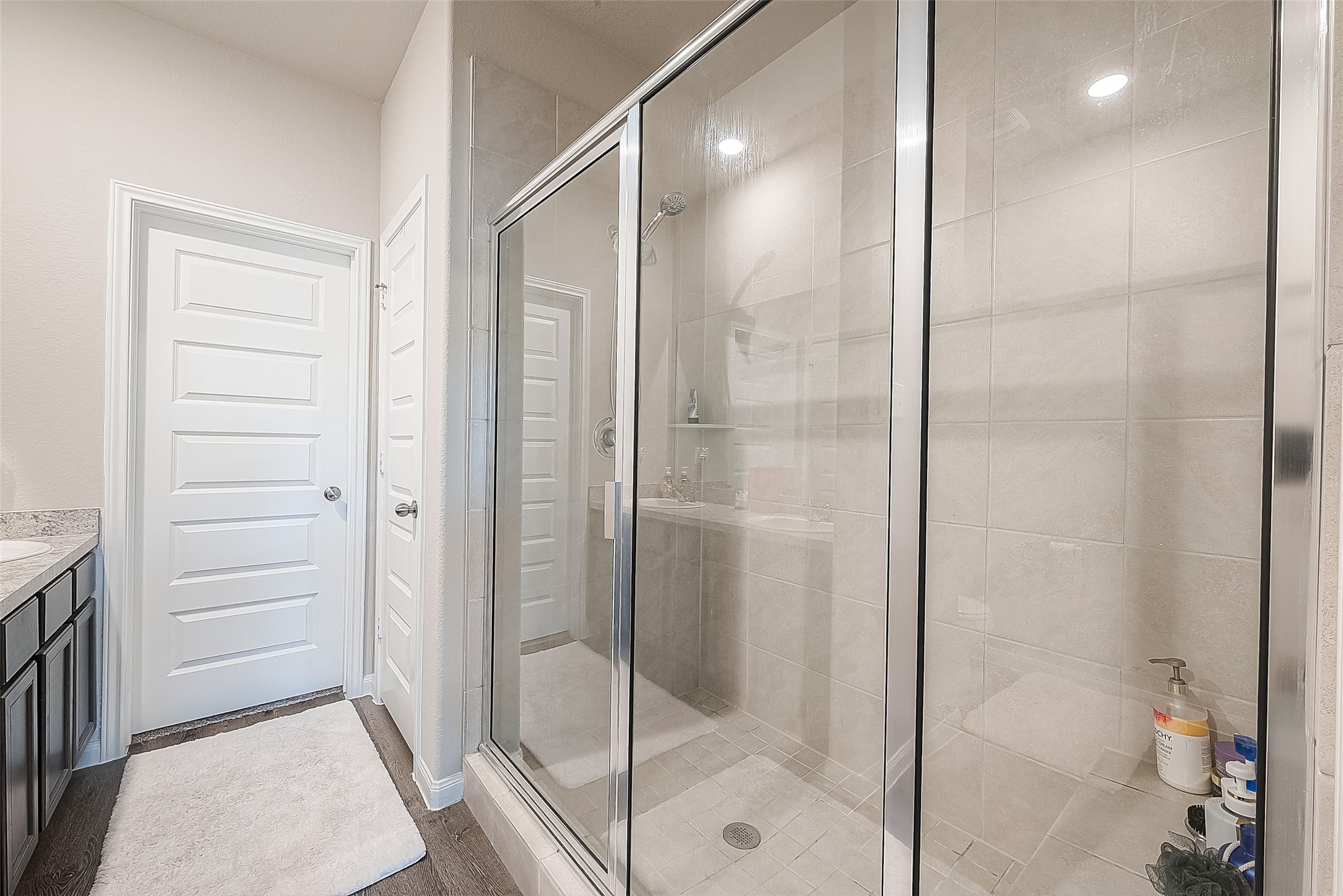 1317 Mount Bassie Trail Conroe, TX 77301 - Photo 28 of 50 a bathroom with a shower and a glass door