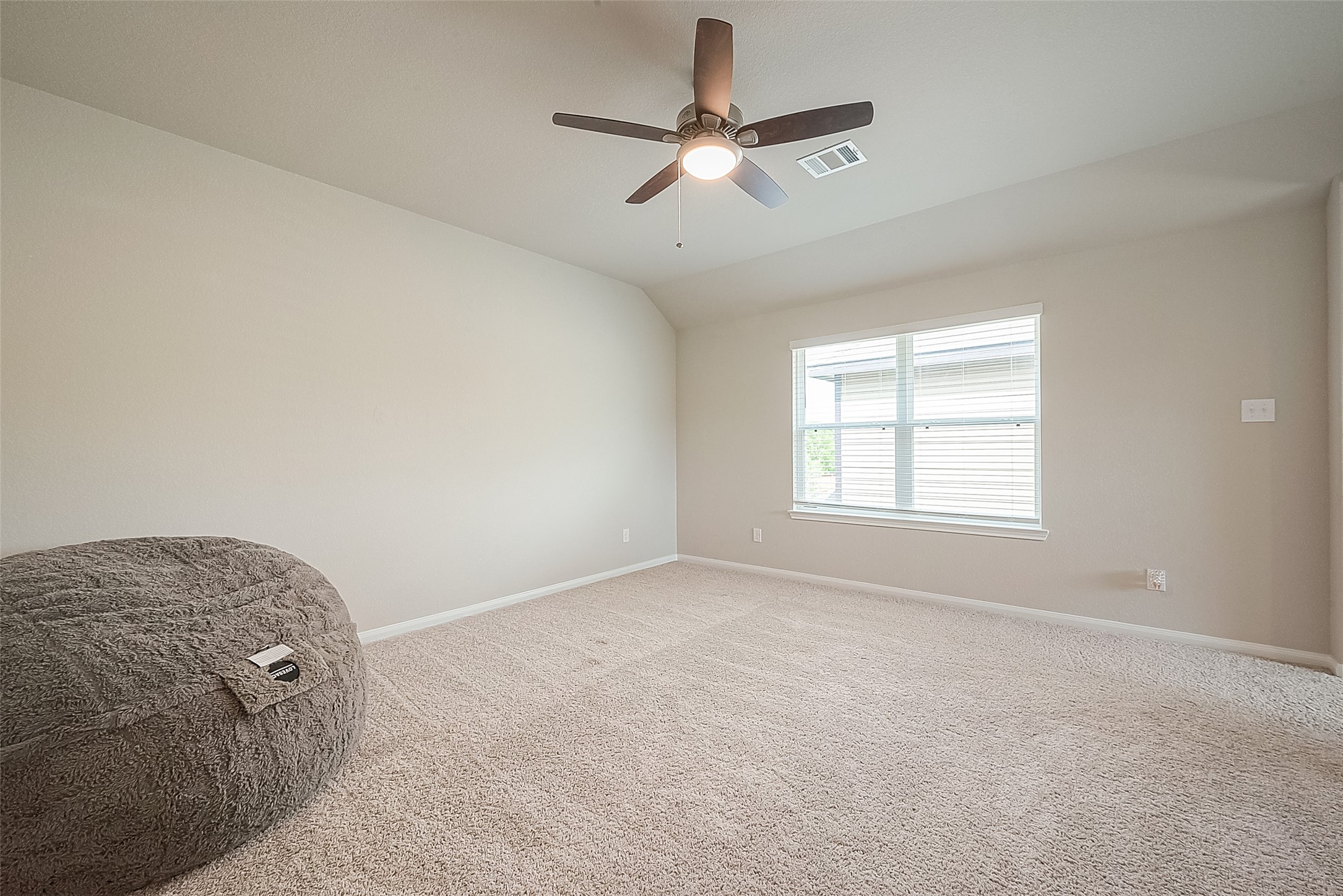 1317 Mount Bassie Trail Conroe, TX 77301 - Photo 33 of 50 an empty room with fan and windows