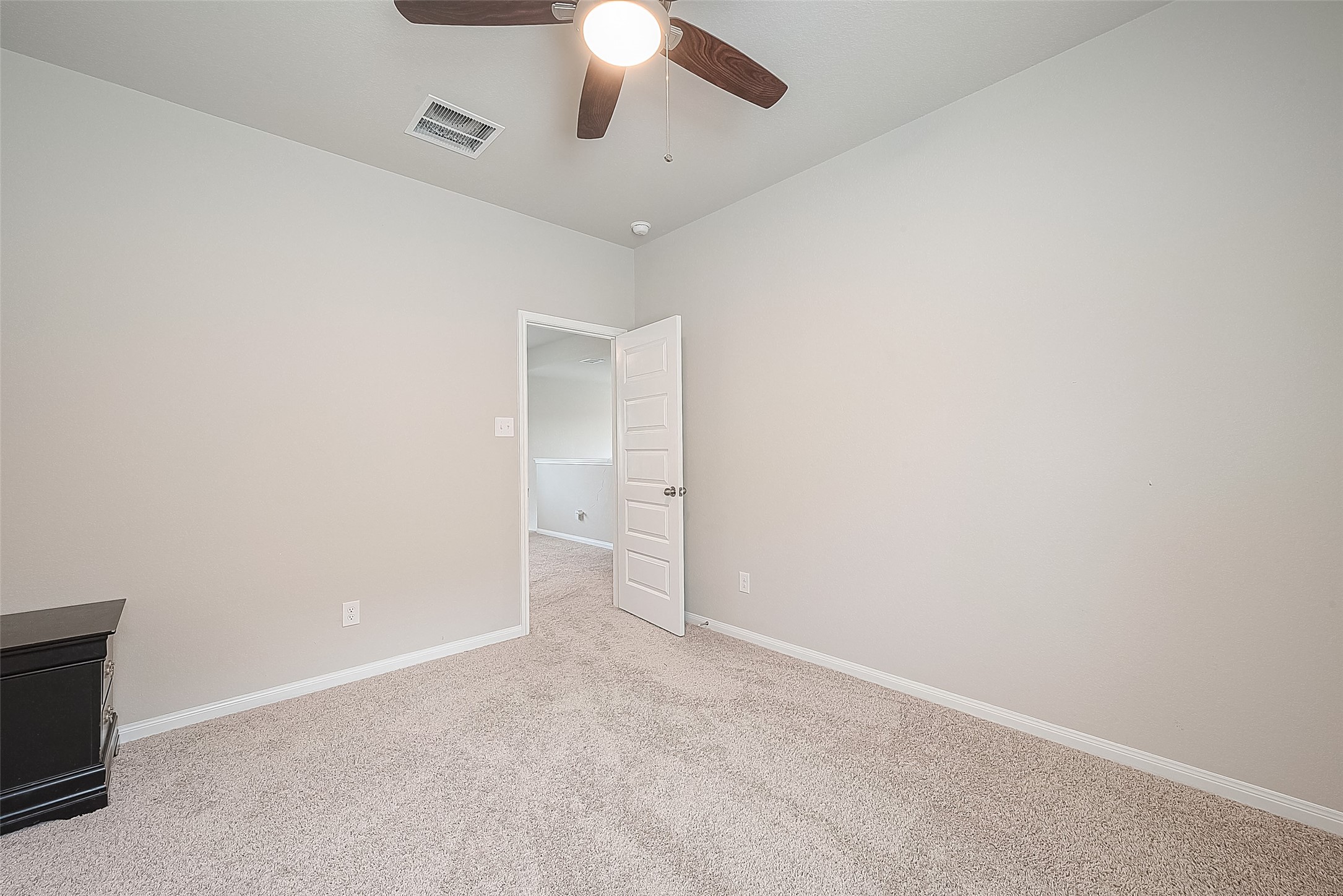 1317 Mount Bassie Trail Conroe, TX 77301 - Photo 36 of 50 an empty room with a empty space and a ceiling fan