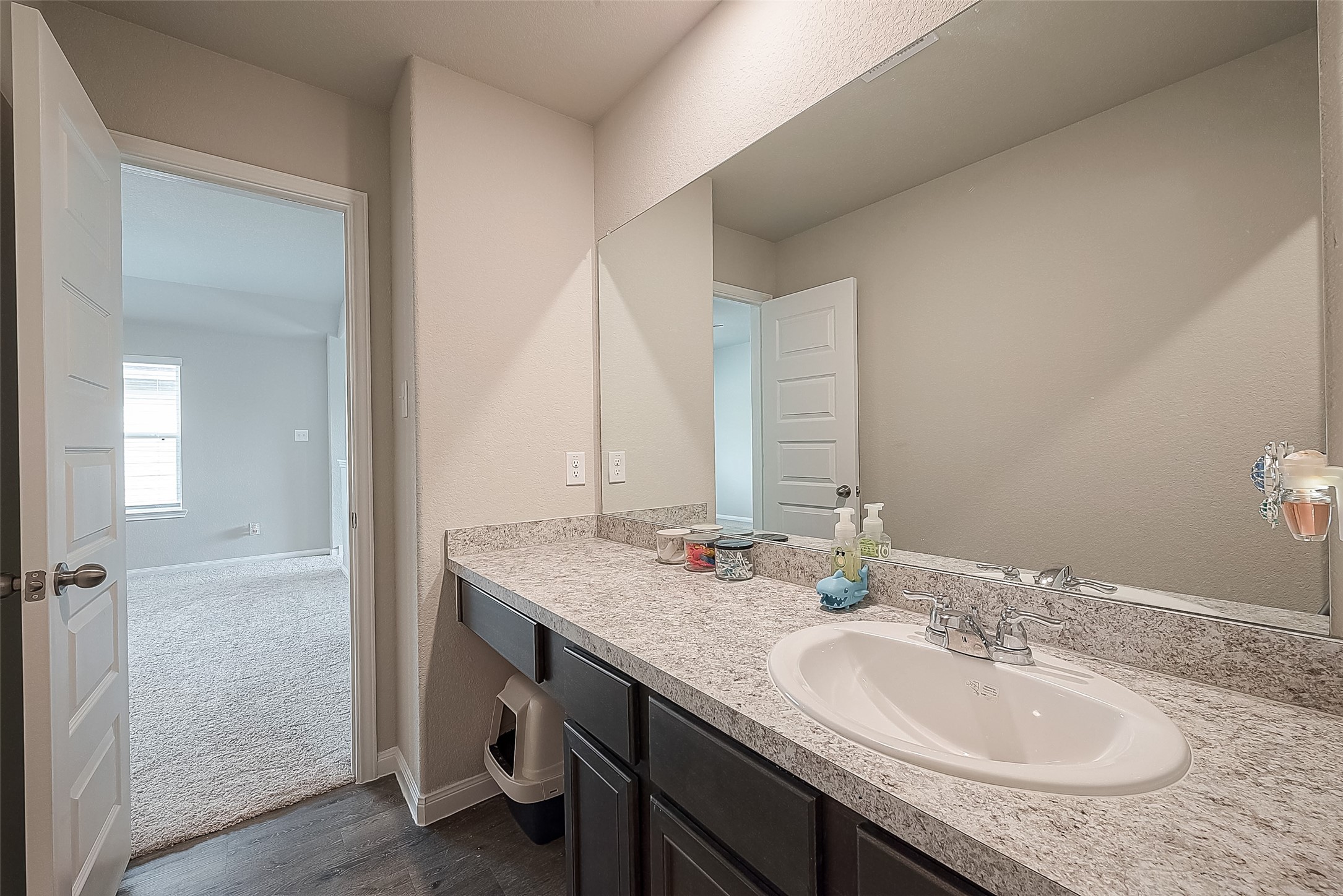 1317 Mount Bassie Trail Conroe, TX 77301 - Photo 44 of 50 a bathroom with a granite countertop sink and a mirror