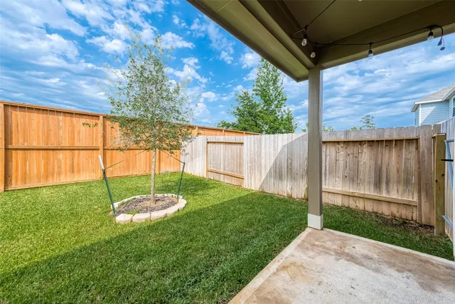 a backyard of a house with lots of green space