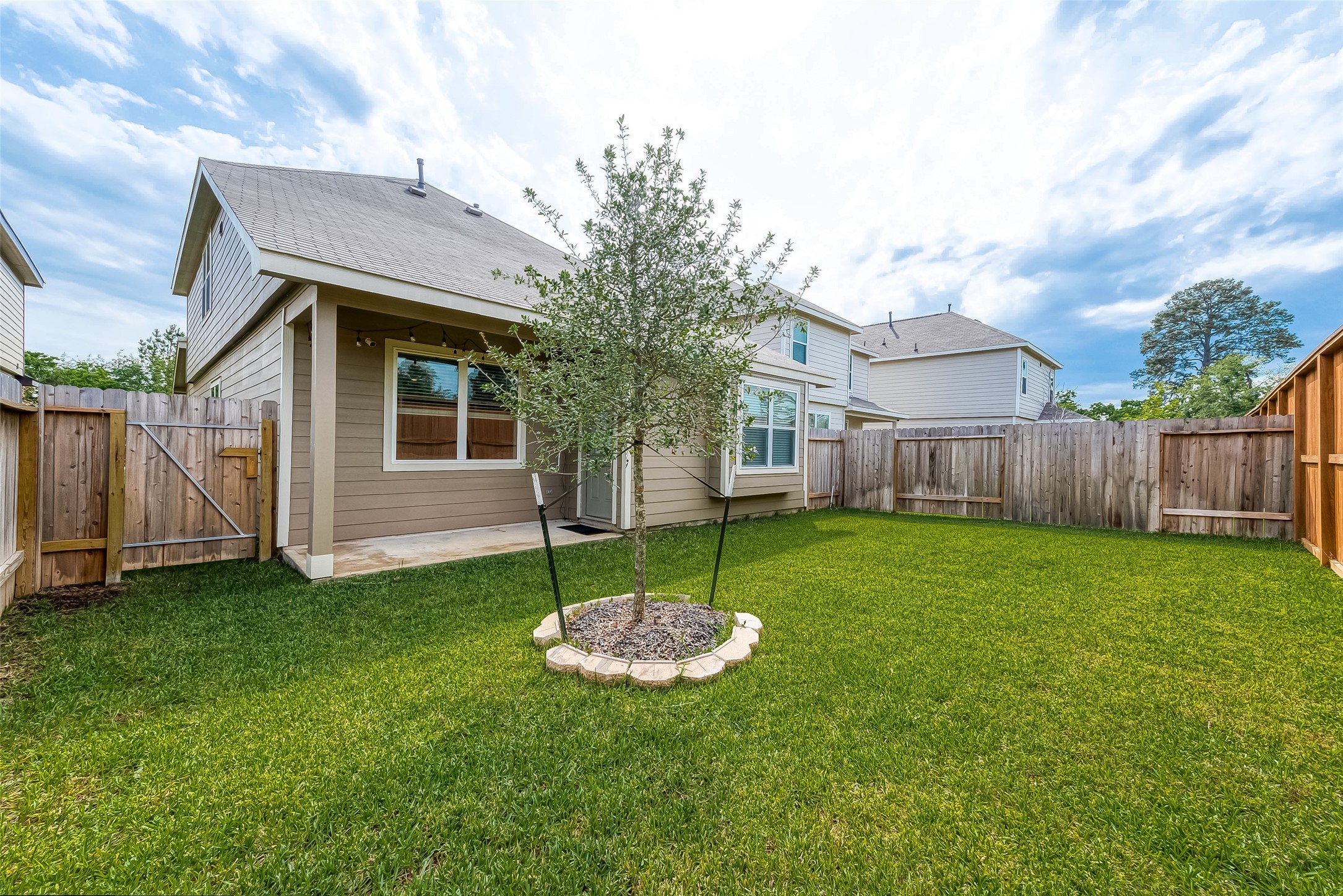 1317 Mount Bassie Trail Conroe, TX 77301 - Photo 48 of 50 a view of a house with a backyard