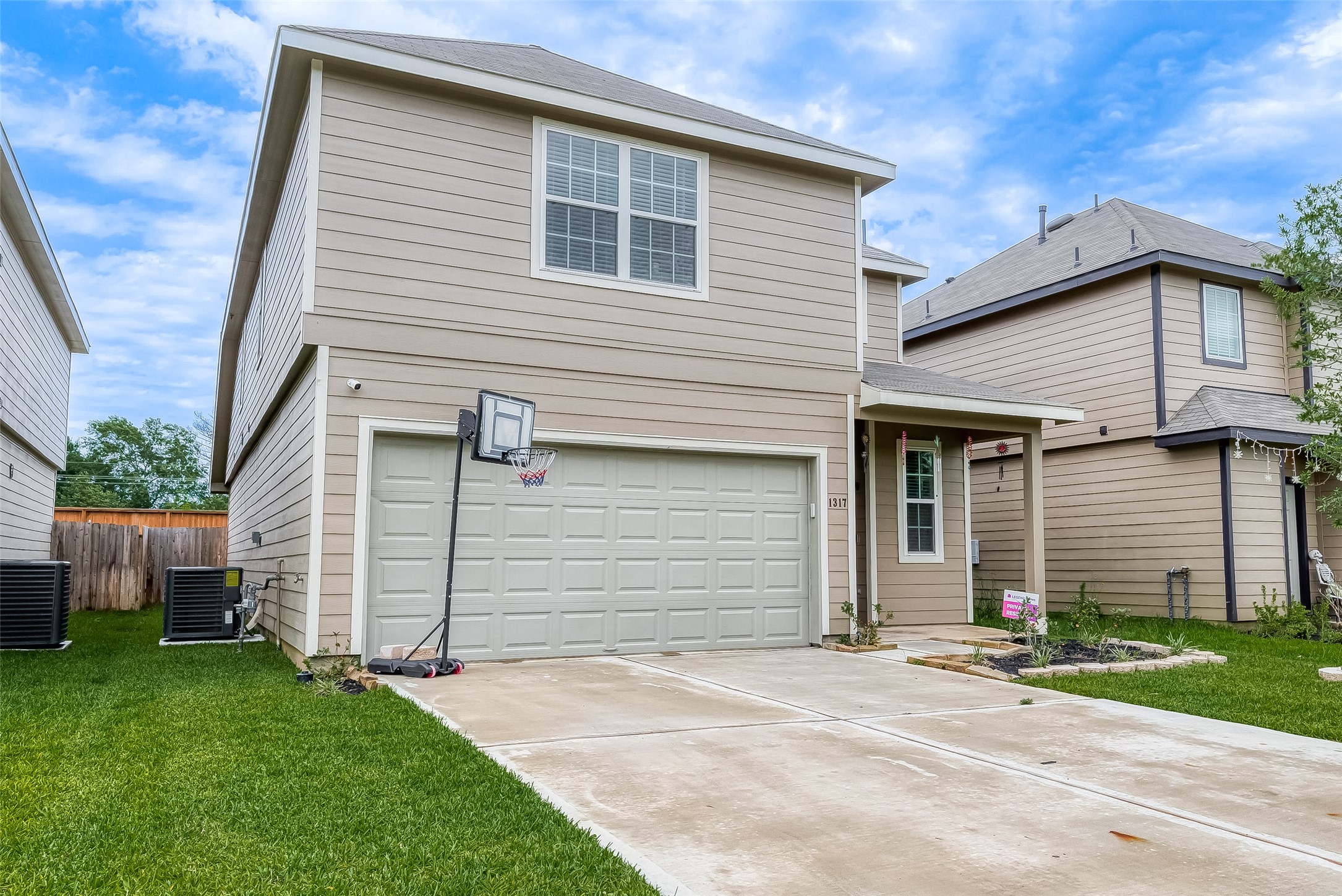 1317 Mount Bassie Trail Conroe, TX 77301 - Photo 5 of 50 a front view of a house with a yard
