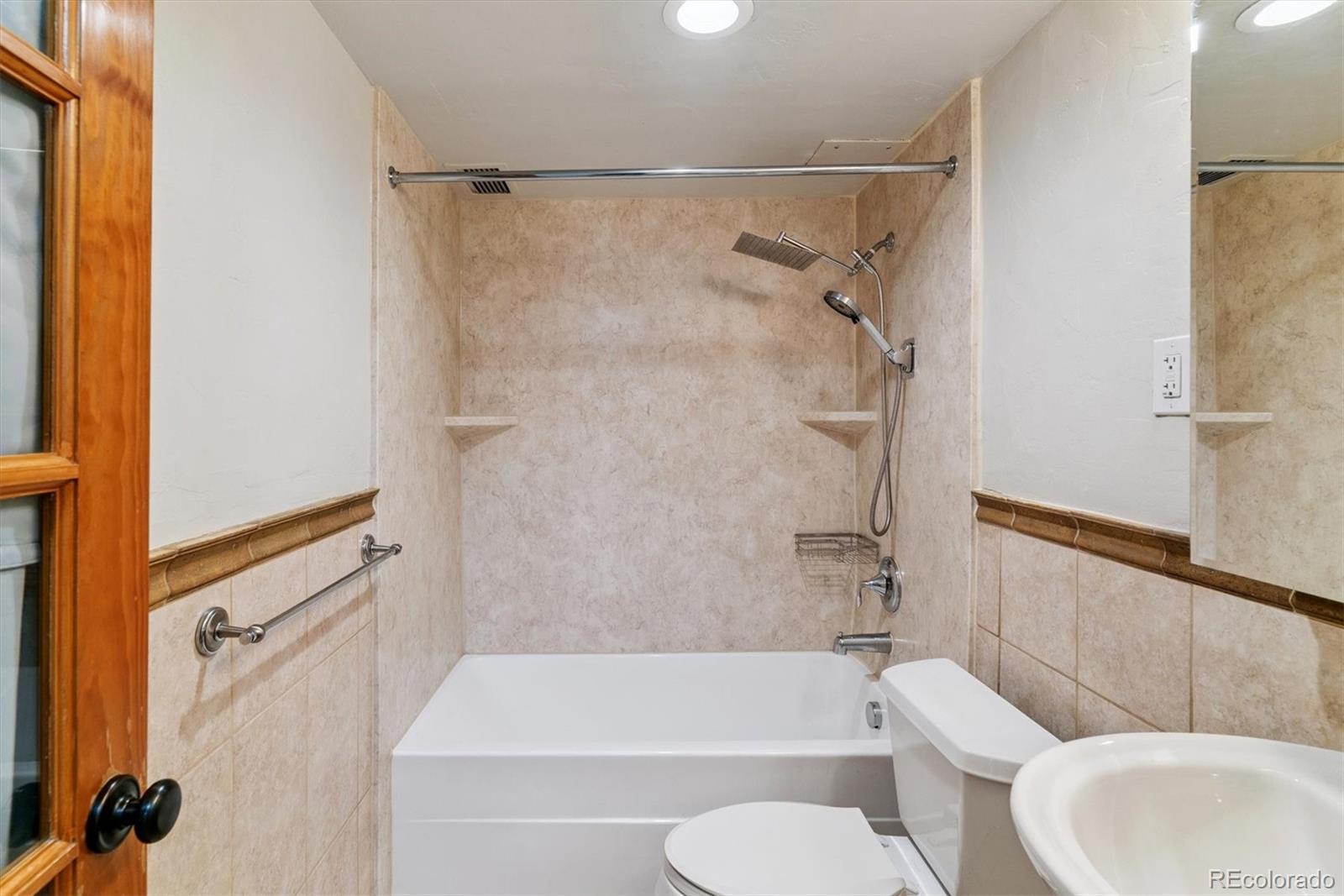 1121 Albion Street, Unit 207 Denver, CO 80220 - Photo 15 of 39 a bathroom with a shower and a toilet