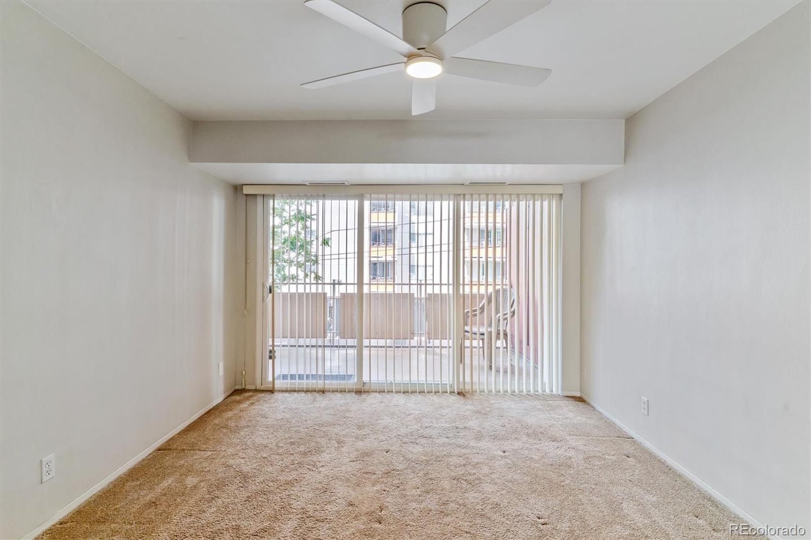 1121 Albion Street, Unit 207 Denver, CO 80220 - Photo 17 of 39 wooden floor in an empty room with a window