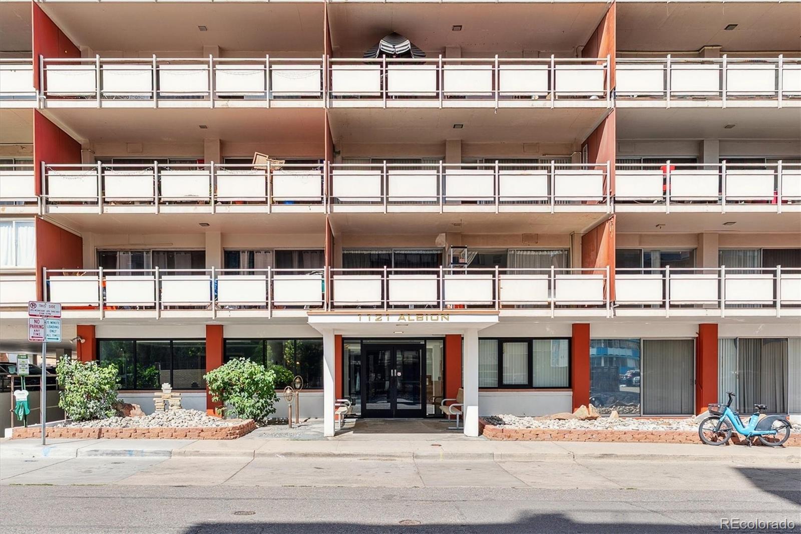 1121 Albion Street, Unit 207 Denver, CO 80220 - Photo 2 of 39 a front view of a building with a street
