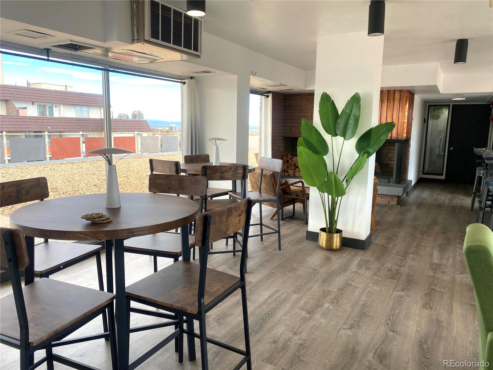 1121 Albion Street, Unit 207 Denver, CO 80220 - Photo 29 of 39 a view of a dining room with furniture and a potted plant