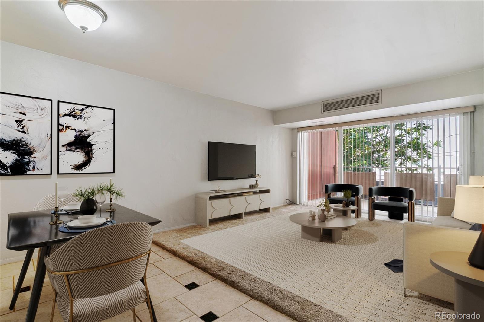 1121 Albion Street, Unit 207 Denver, CO 80220 - Photo 3 of 39 a living room with furniture and large windows