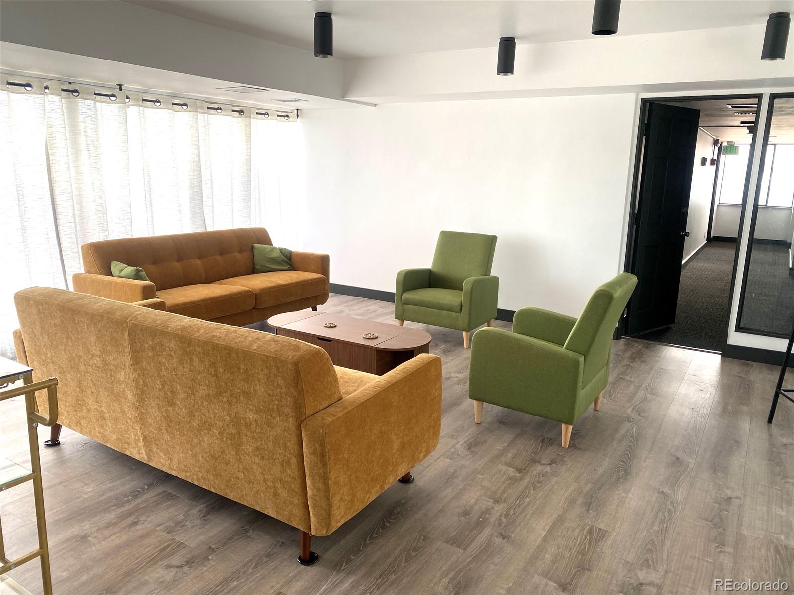 1121 Albion Street, Unit 207 Denver, CO 80220 - Photo 32 of 39 a living room with furniture and a large window