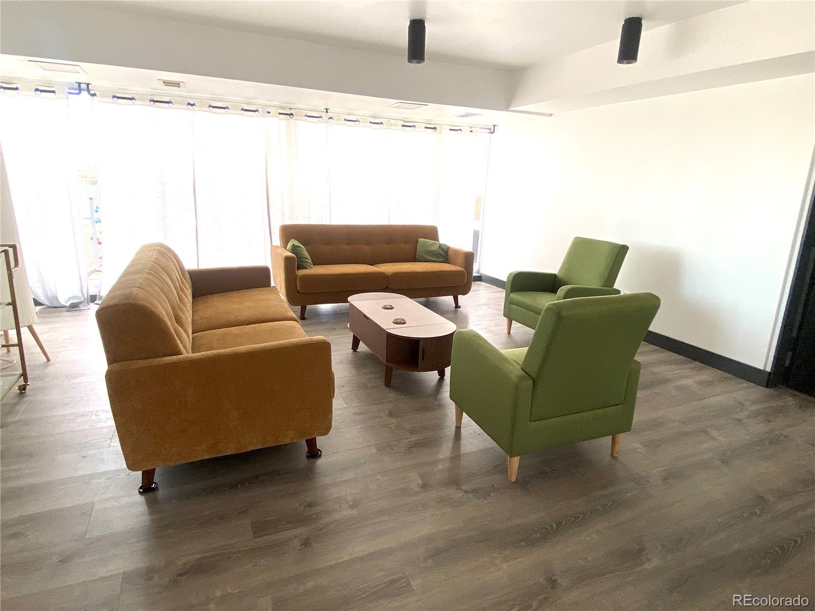 1121 Albion Street, Unit 207 Denver, CO 80220 - Photo 34 of 39 a living room with furniture and a large window