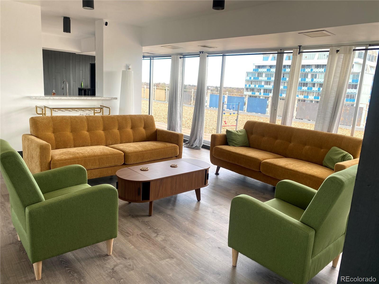 1121 Albion Street, Unit 207 Denver, CO 80220 - Photo 35 of 39 a living room with furniture and a flat screen tv
