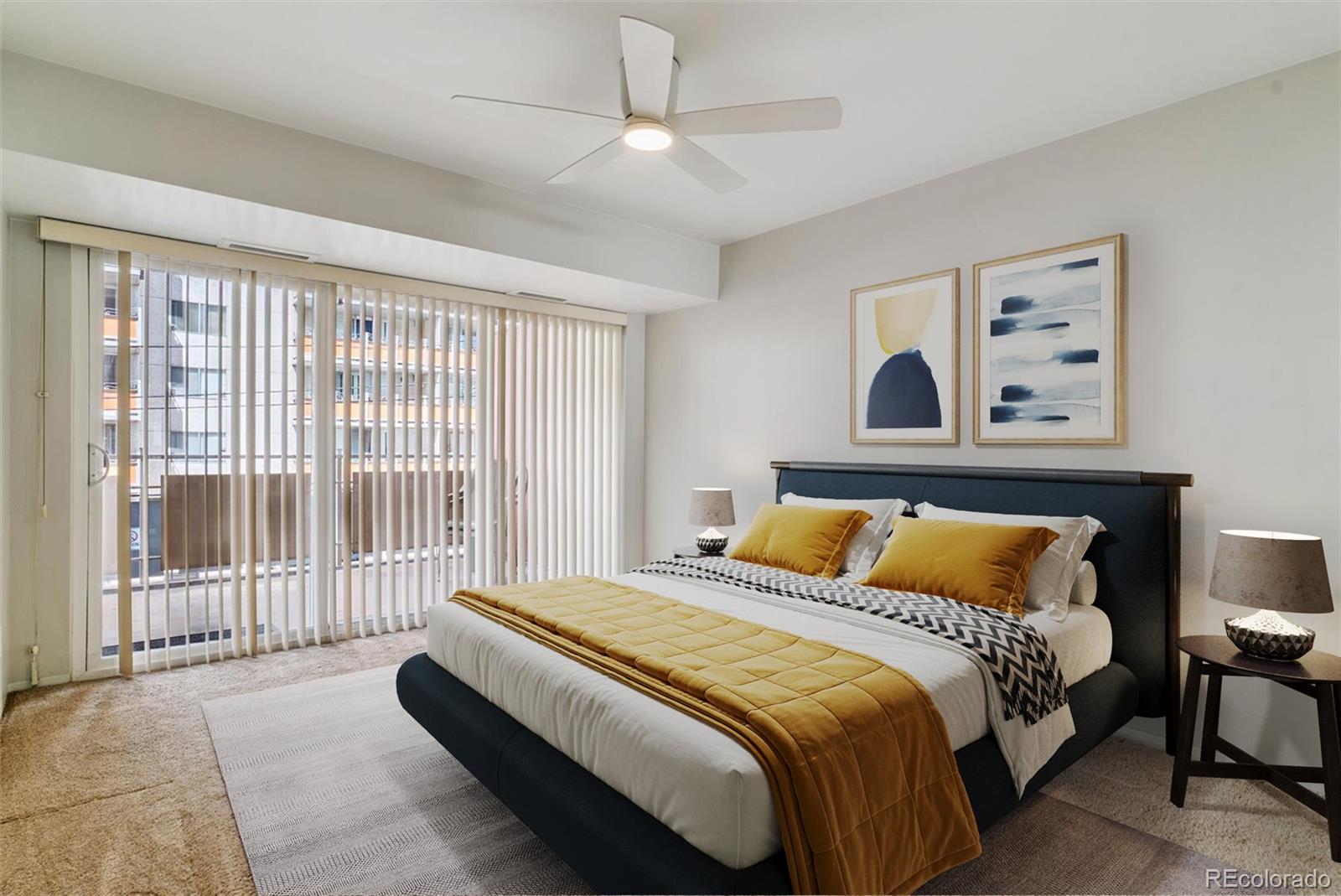 1121 Albion Street, Unit 207 Denver, CO 80220 - Photo 6 of 39 a bedroom with a large bed and a couch