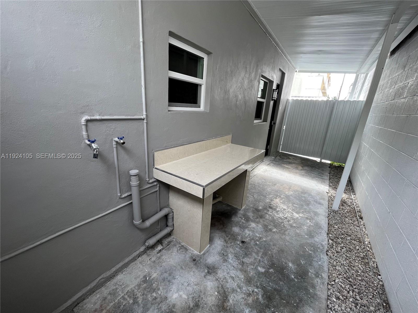 920 Southwest 30th Avenue, Unit 2 Miami, FL 33135 - Photo 18 of 18 a room with furniture and window