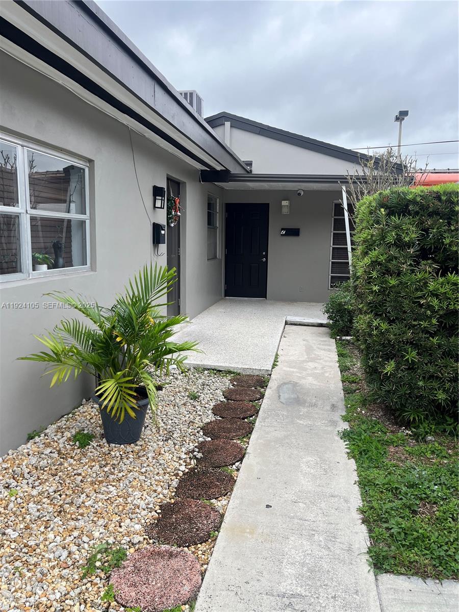 920 Southwest 30th Avenue, Unit 2 Miami, FL 33135 - Photo 2 of 18 a front view of a house with a yard