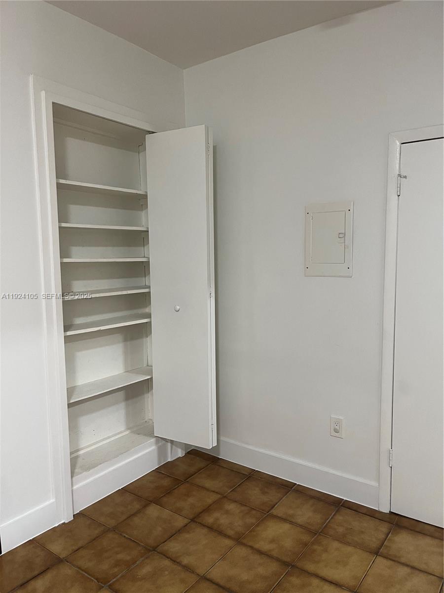 920 Southwest 30th Avenue, Unit 2 Miami, FL 33135 - Photo 9 of 18 a view of walk in closet with empty racks