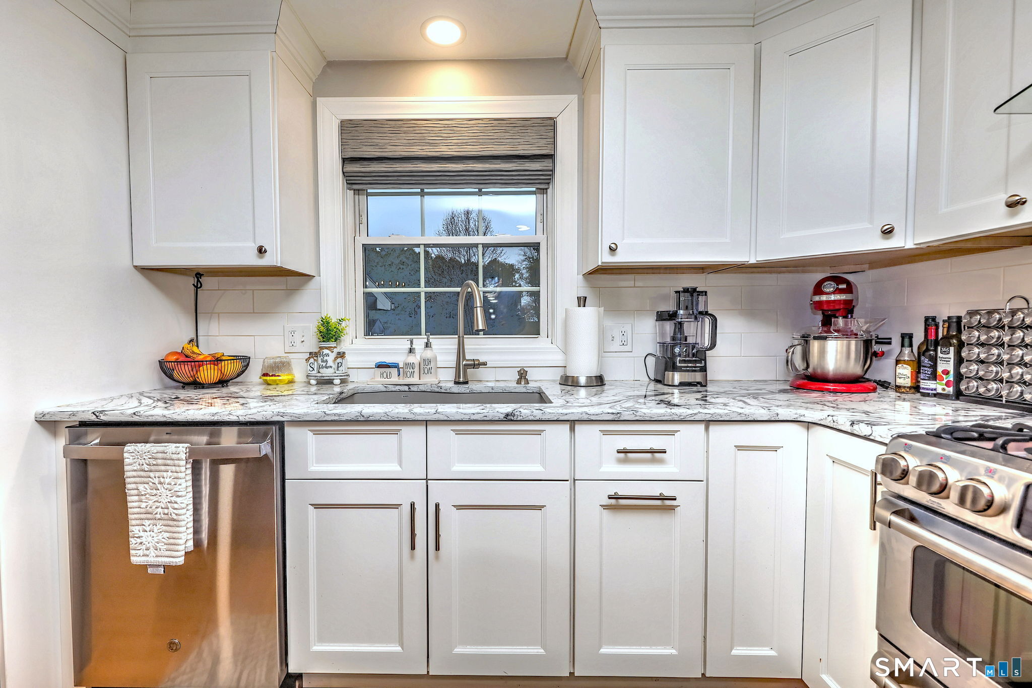 40 Sapphire Street Enfield, CT 06082 - Photo 11 of 41 a kitchen with white cabinets and sink