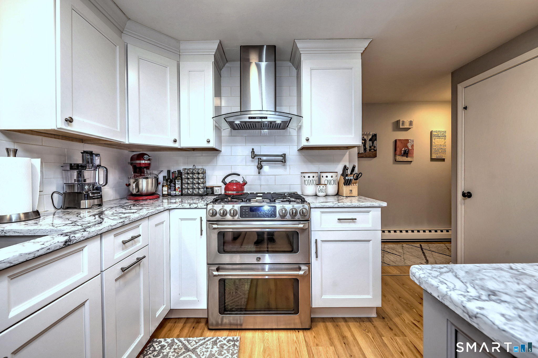 40 Sapphire Street Enfield, CT 06082 - Photo 12 of 41 a kitchen with stainless steel appliances granite countertop a stove a sink and cabinets