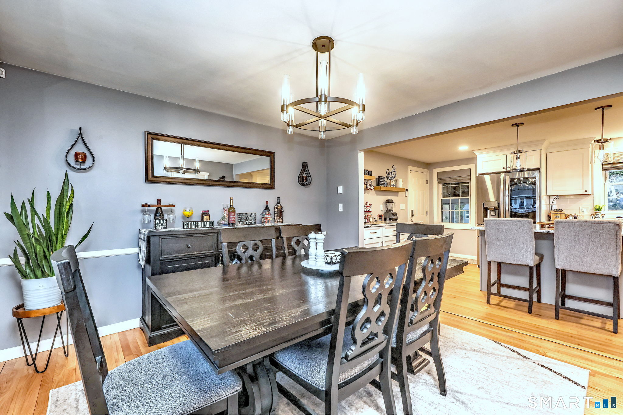 40 Sapphire Street Enfield, CT 06082 - Photo 19 of 41 a view of a dining room with furniture wooden floor and chandelier