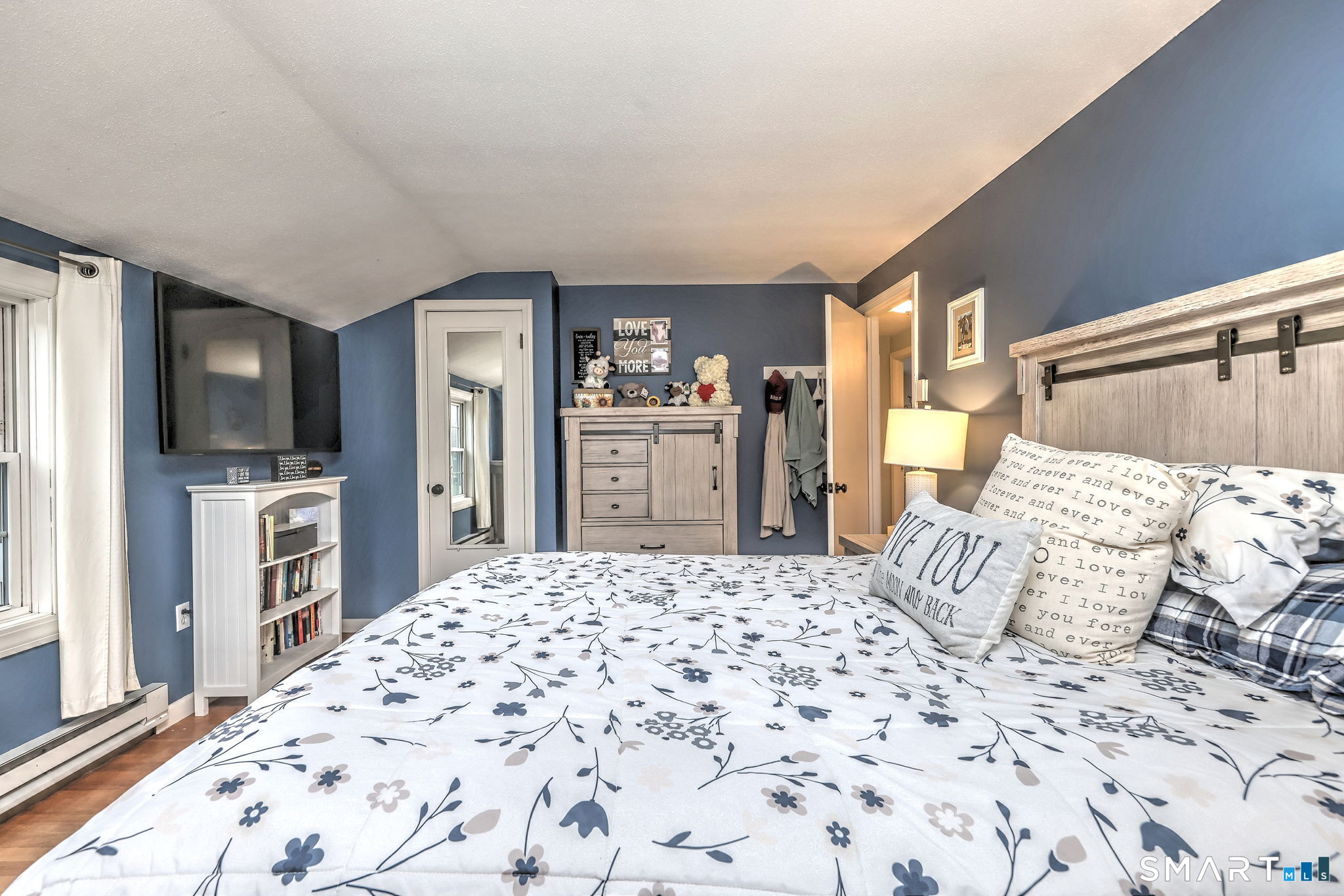 40 Sapphire Street Enfield, CT 06082 - Photo 25 of 41 a bedroom with a large bed and a flat screen tv