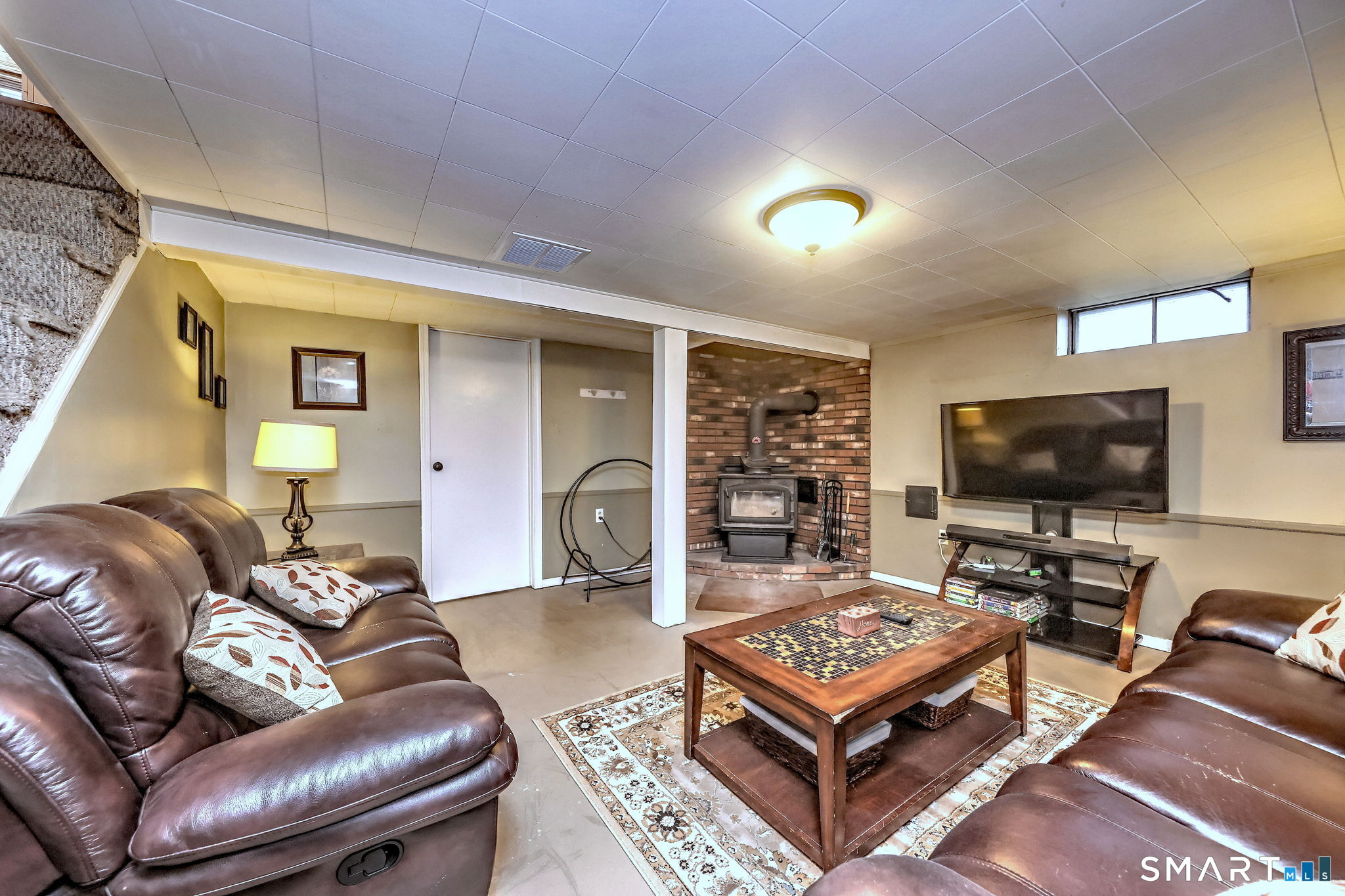40 Sapphire Street Enfield, CT 06082 - Photo 31 of 41 a living room with furniture and a flat screen tv