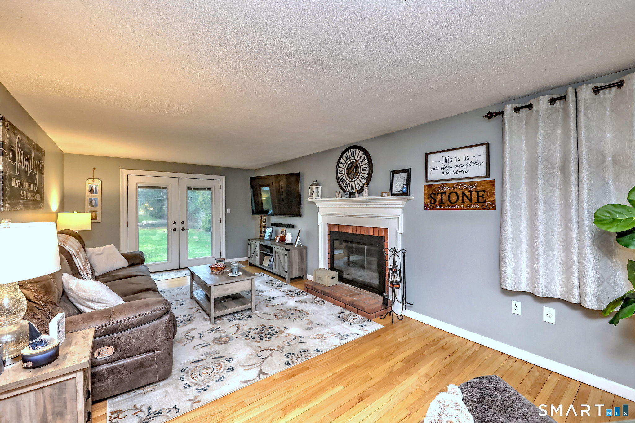 40 Sapphire Street Enfield, CT 06082 - Photo 5 of 41 a living room with furniture and a fireplace