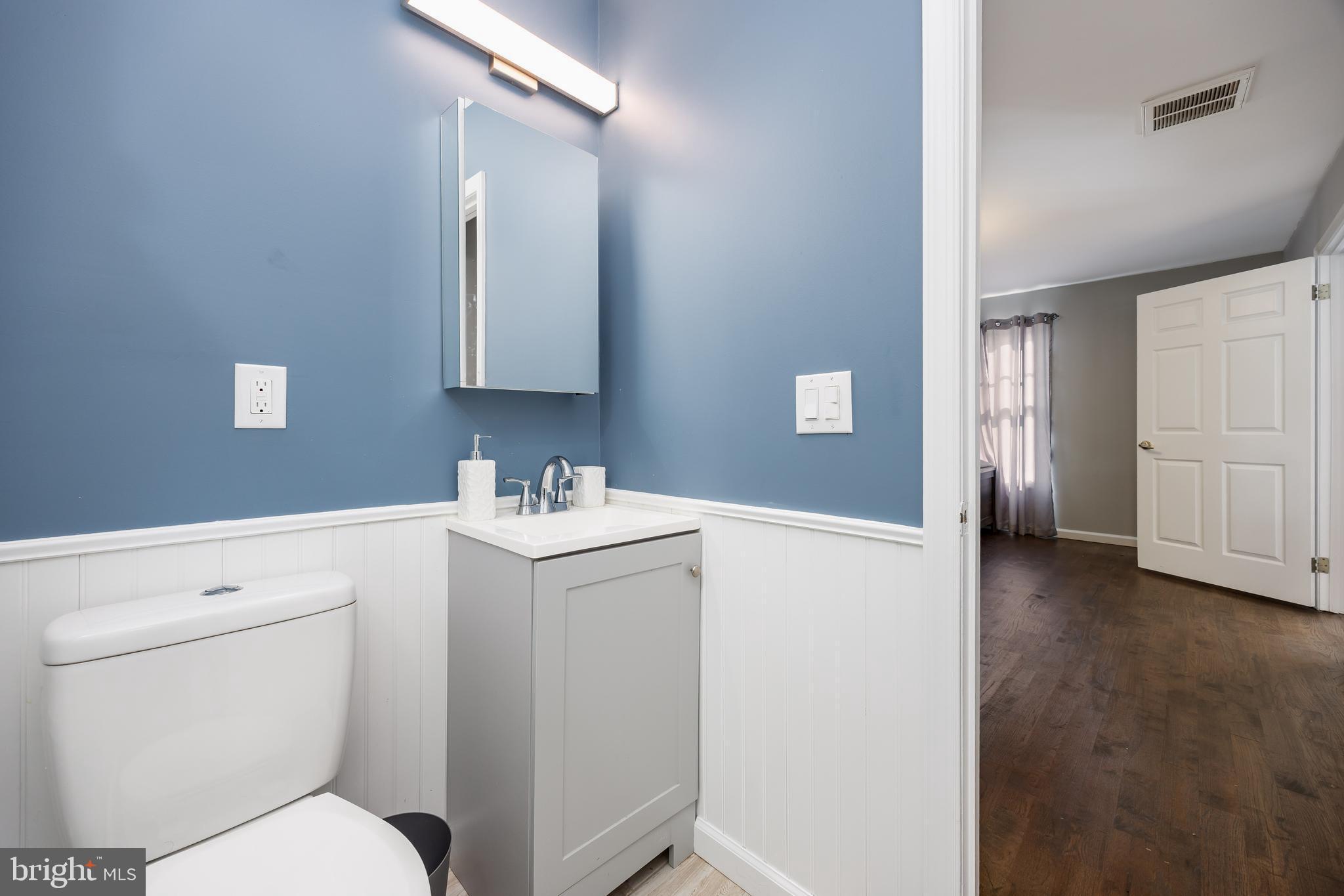 14470 Backbone Road Eden, MD 21822 - Photo 34 of 55 a bathroom with a toilet sink and mirror