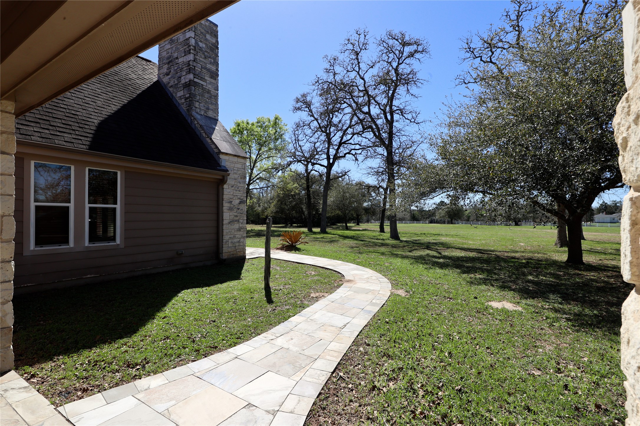 3337 Brunes Mill Road Columbus, TX 78934 - Photo 32 of 48 a front view of a house with a yard
