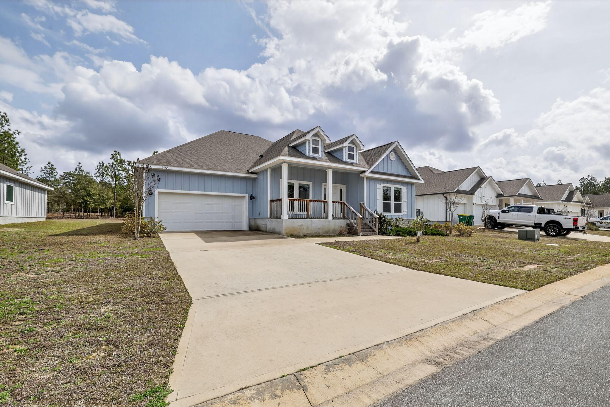 2452 Dakota Way Crestview, FL 32536 - Photo 1 of 24 a front view of a house with a yard and garage