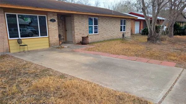 a view of a house with a yard and garage