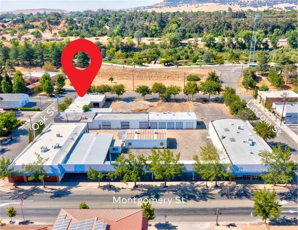 an aerial view of a city with streets and houses