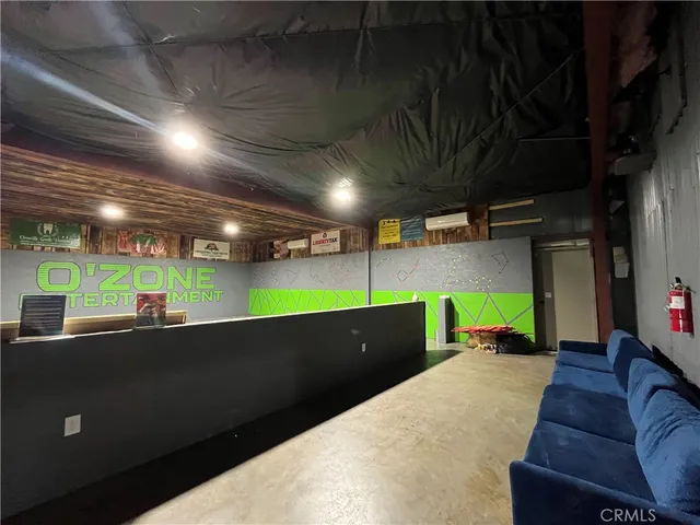 a living room with furniture and a projector