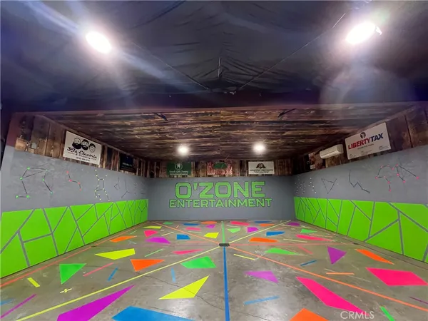 a room with pool table windows and outdoor view